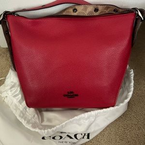 Red Coach side bag with adjustable over-the-shoulder strap length